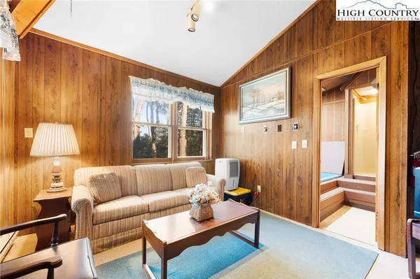 a kitchen with a refrigerator and a sink