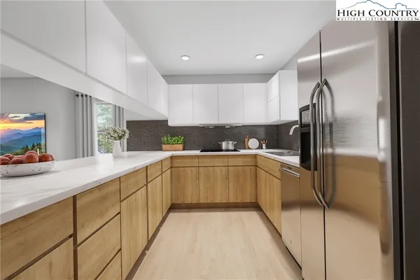 a kitchen with refrigerator and window