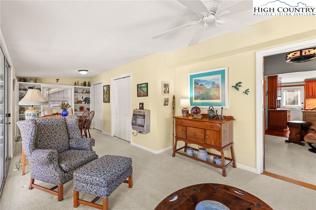 228 Snowshoe Loop Newland, NC 28657 - Photo 13 of 50 a living room with furniture and a flat screen tv