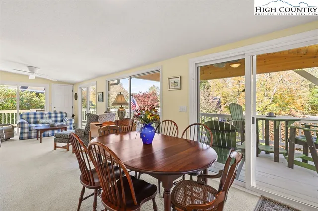 a view of a dining room with furniture and window
