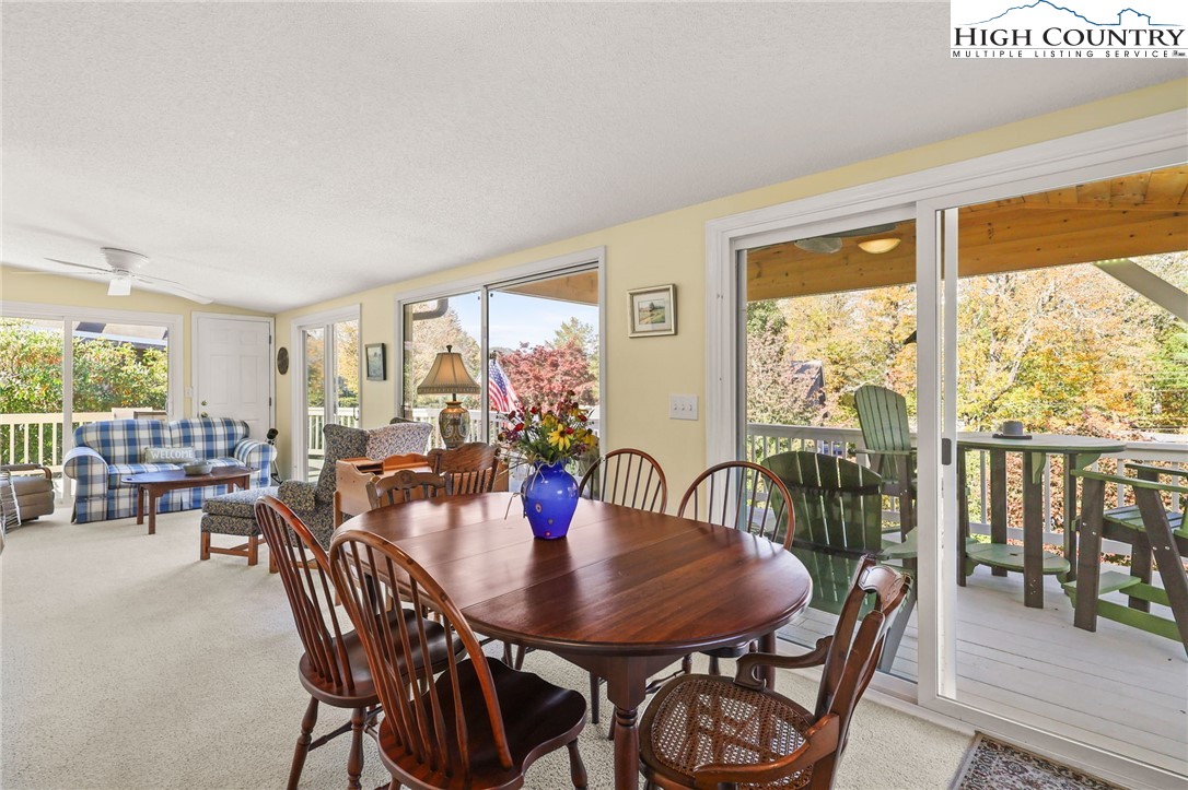 228 Snowshoe Loop Newland, NC 28657 - Photo 15 of 50 a view of a dining room with furniture and window