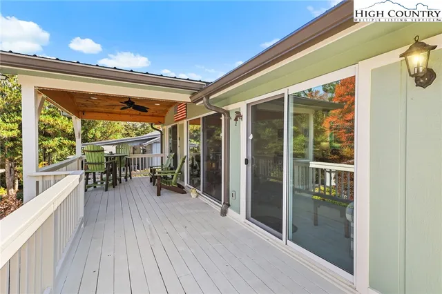 a view of two chairs in a balcony