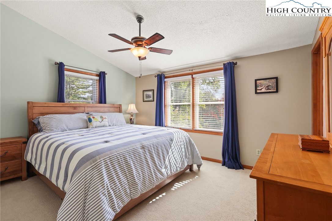 228 Snowshoe Loop Newland, NC 28657 - Photo 20 of 50 a bedroom with a bed and a window