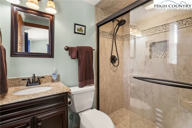 a bed room with a bed and a chandelier