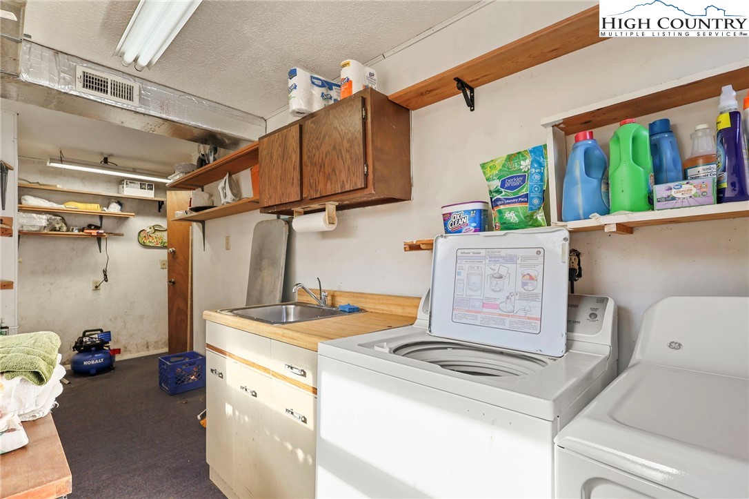 228 Snowshoe Loop Newland, NC 28657 - Photo 29 of 50 a utility room with dryer and washer