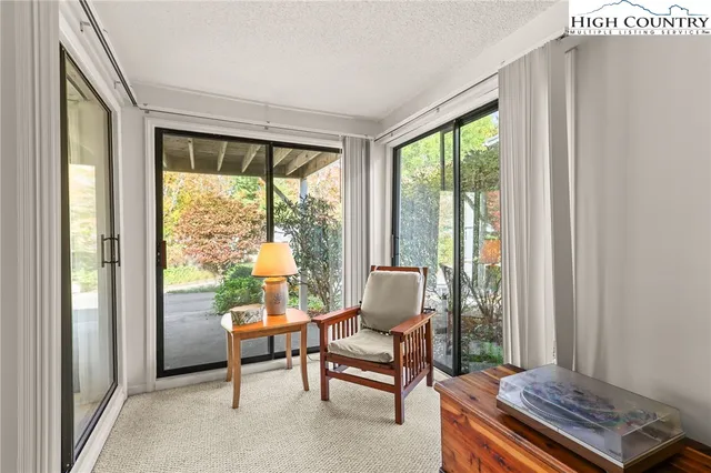 a living room with a couch and a window