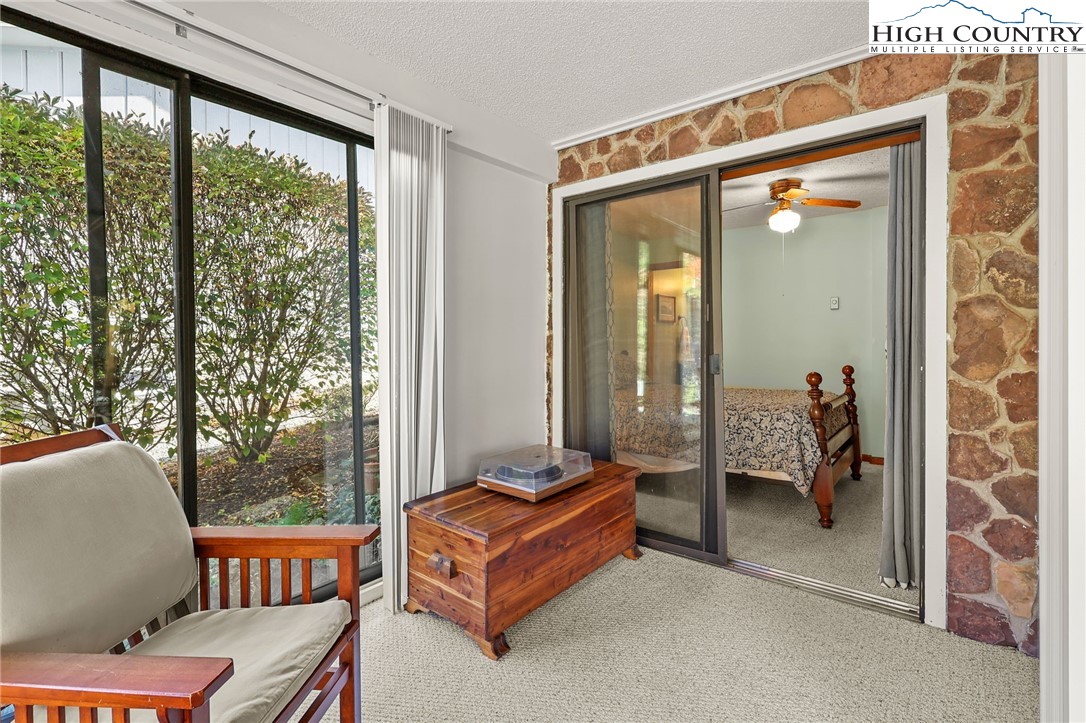228 Snowshoe Loop Newland, NC 28657 - Photo 35 of 50 a living room with a couch and a window