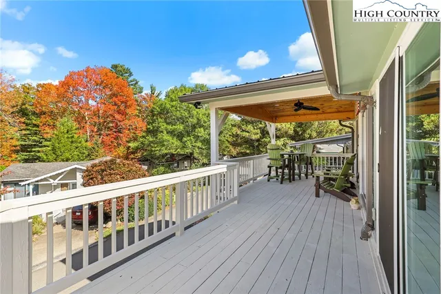 a view of a patio with a table and chairs