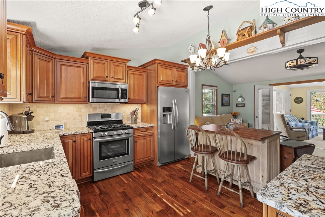 228 Snowshoe Loop Newland, NC 28657 - Photo 4 of 50 a view of a kitchen and dining room