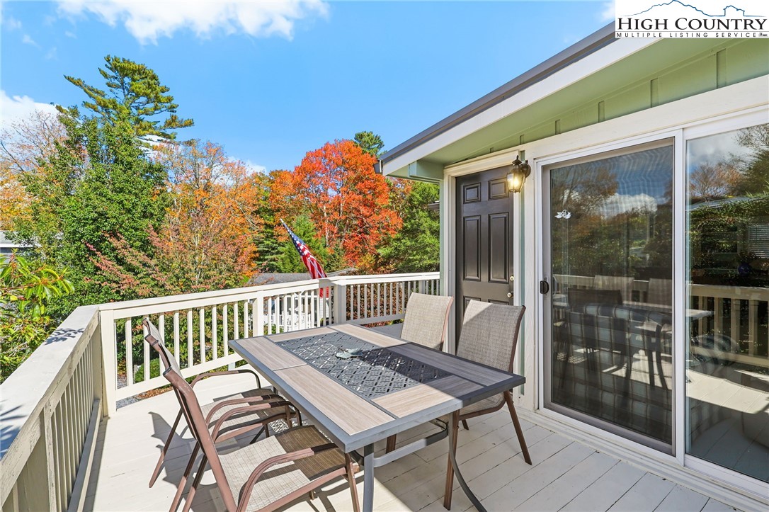 228 Snowshoe Loop Newland, NC 28657 - Photo 41 of 50 a view of a patio with a table and chairs