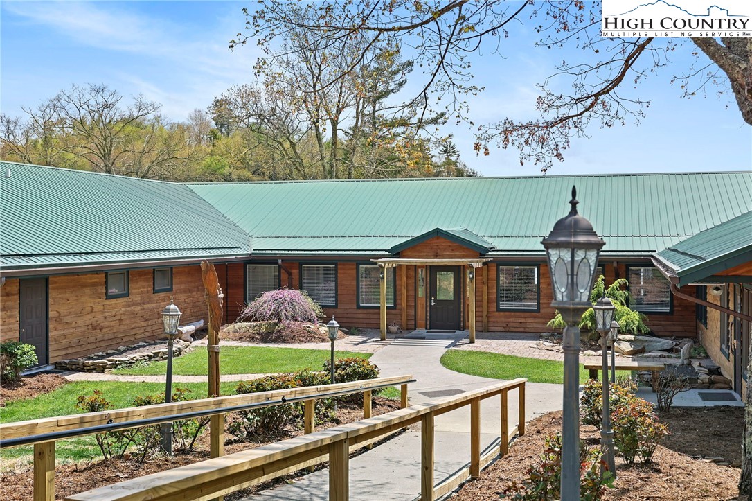 228 Snowshoe Loop Newland, NC 28657 - Photo 47 of 50 a front view of a house with garden