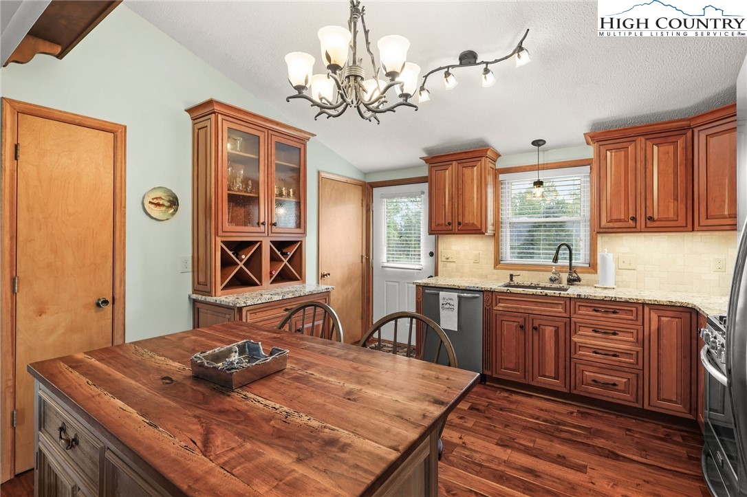228 Snowshoe Loop Newland, NC 28657 - Photo 6 of 50 a kitchen with a table chairs stove and cabinets