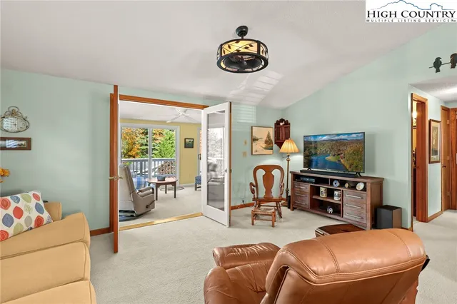 a room with furniture and a flat screen tv