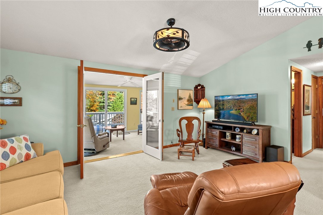 228 Snowshoe Loop Newland, NC 28657 - Photo 9 of 50 a room with furniture and a flat screen tv