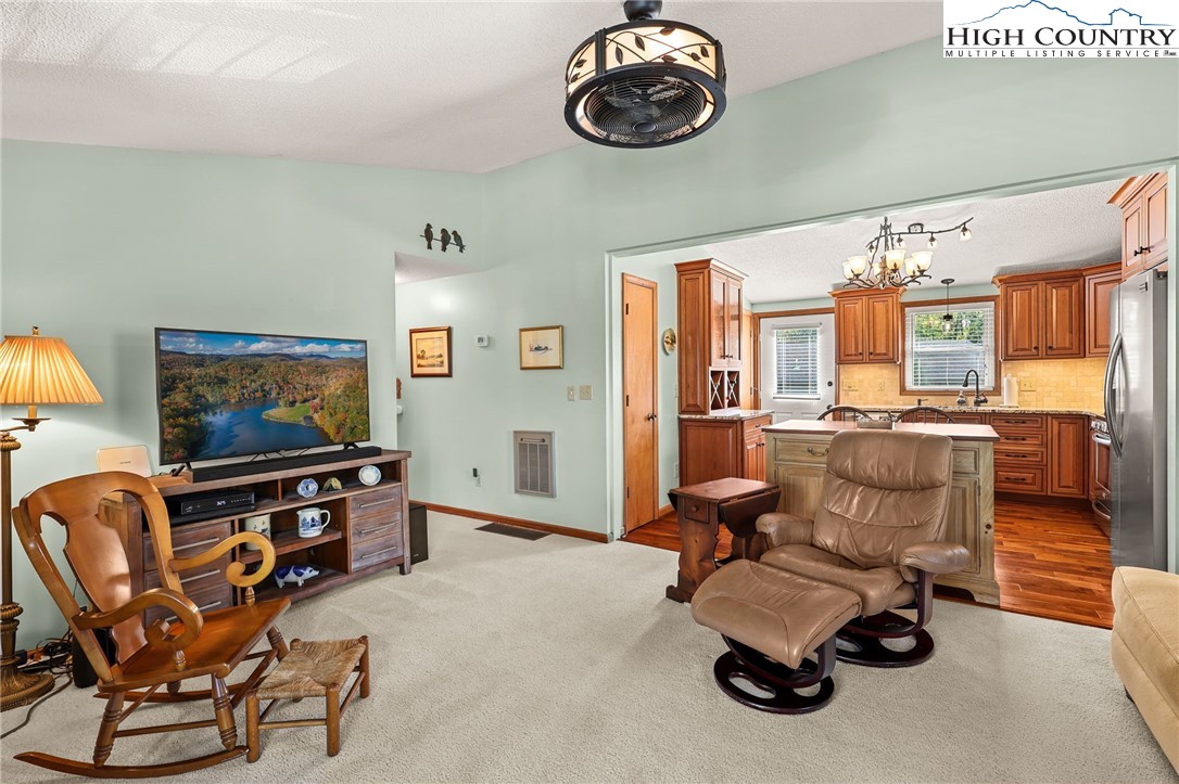 228 Snowshoe Loop Newland, NC 28657 - Photo 10 of 50 a view of a livingroom with furniture and a window