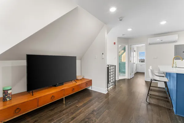 a view of a living room and a flat screen tv