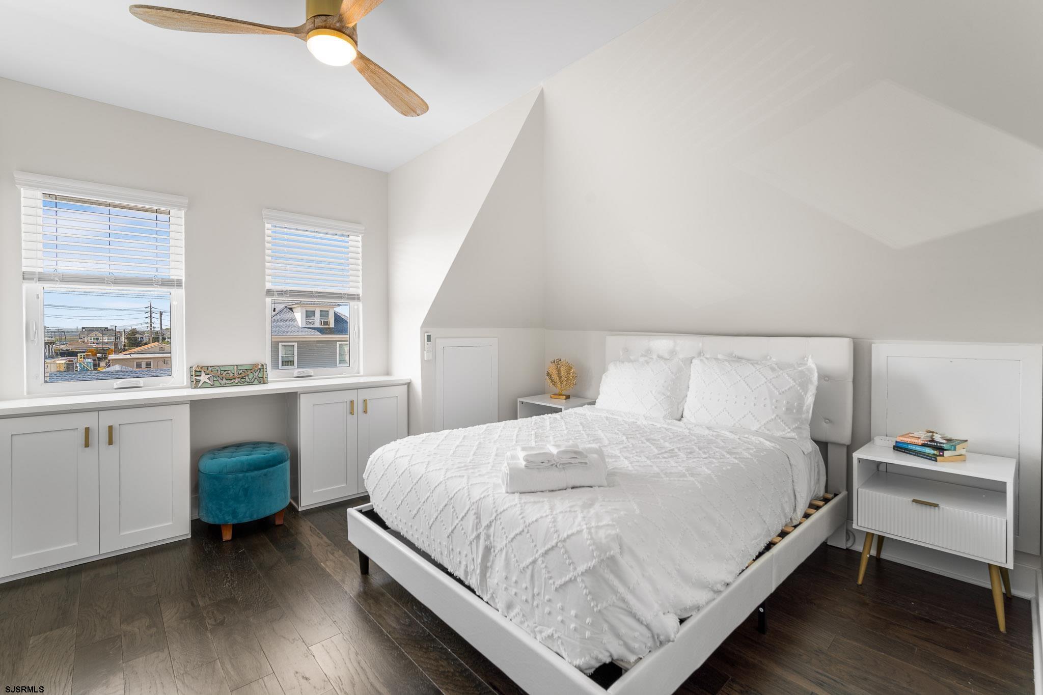 1059 Asbury Avenue, Unit 3 Ocean City, NJ 08226 - Photo 5 of 14 a bedroom with a bed and window