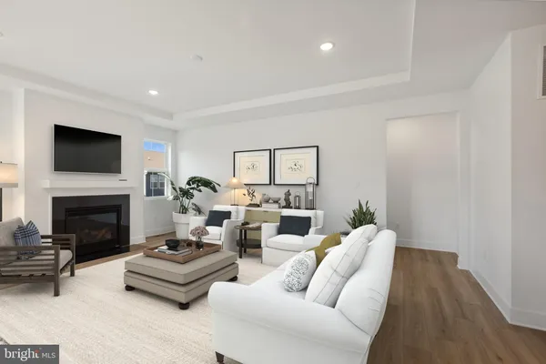 a living room with furniture fireplace and a flat screen tv