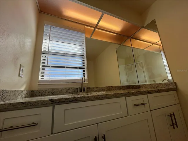 a white toilet sitting next to a shower