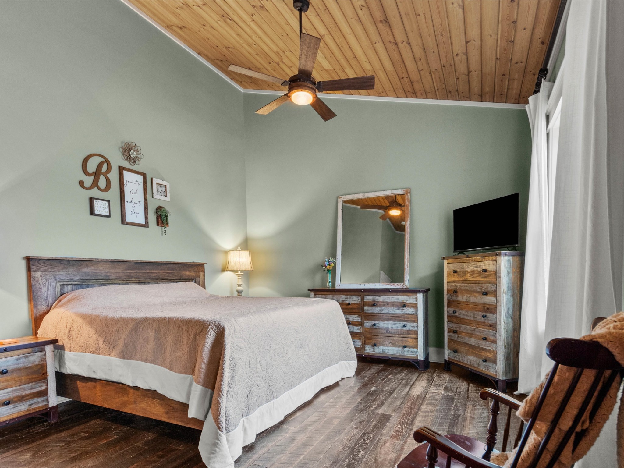 950 Puncheon Branch Road Minor Hill, TN 38473 - Photo 16 of 51 a bedroom with a bed and a television