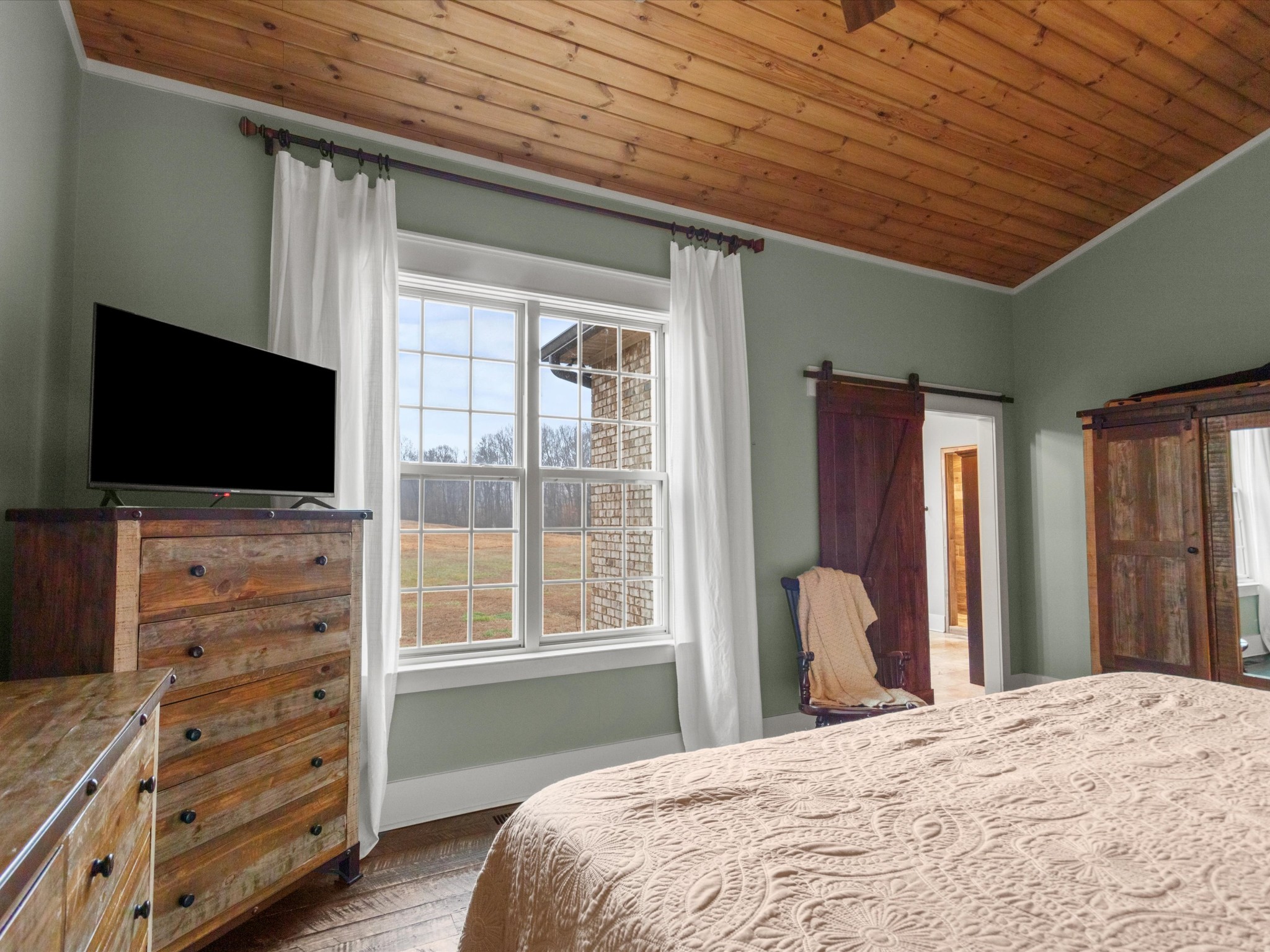 950 Puncheon Branch Road Minor Hill, TN 38473 - Photo 17 of 51 a bedroom with a flat tv and a dresser