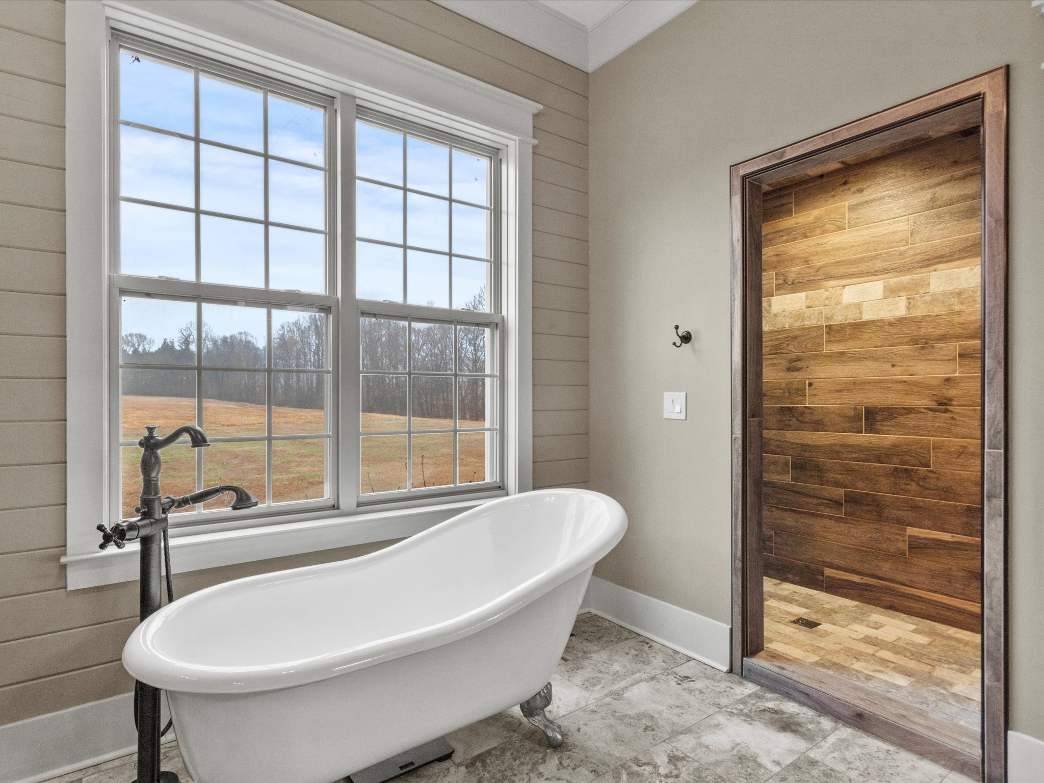 950 Puncheon Branch Road Minor Hill, TN 38473 - Photo 19 of 51 a bathroom with a bathtub and a shower