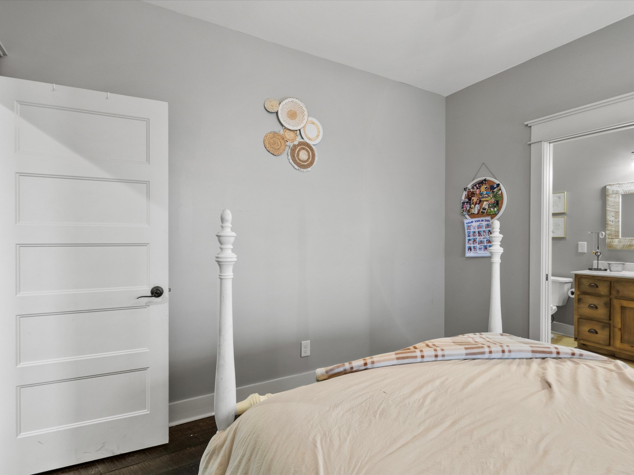 950 Puncheon Branch Road Minor Hill, TN 38473 - Photo 24 of 51 a bedroom with a bed and a chandelier