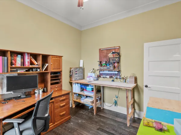a view of a workspace with furniture and toys
