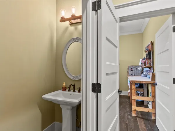 a bathroom with a sink a mirror and a toilet