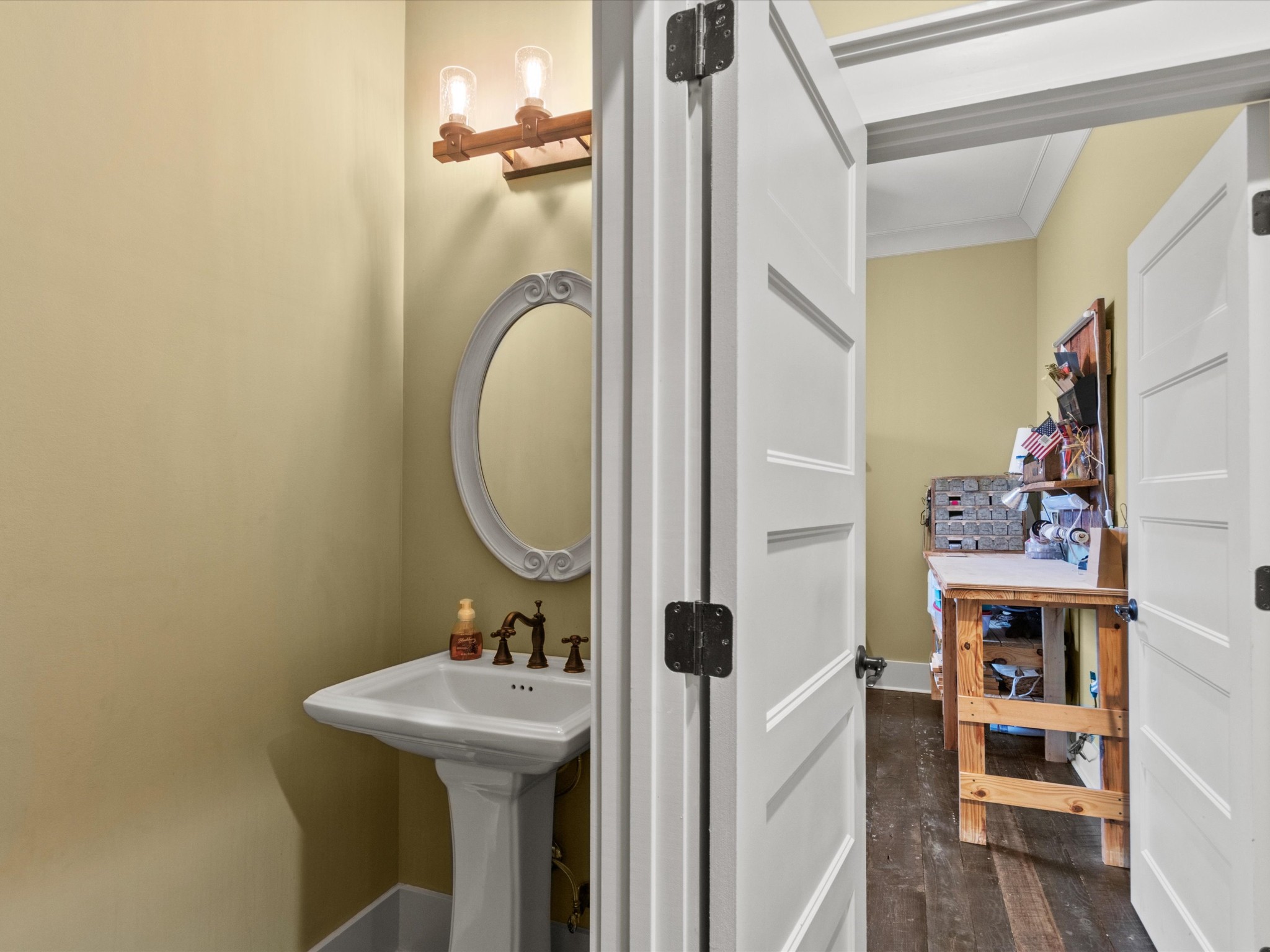 950 Puncheon Branch Road Minor Hill, TN 38473 - Photo 34 of 51 a bathroom with a sink a mirror and a toilet