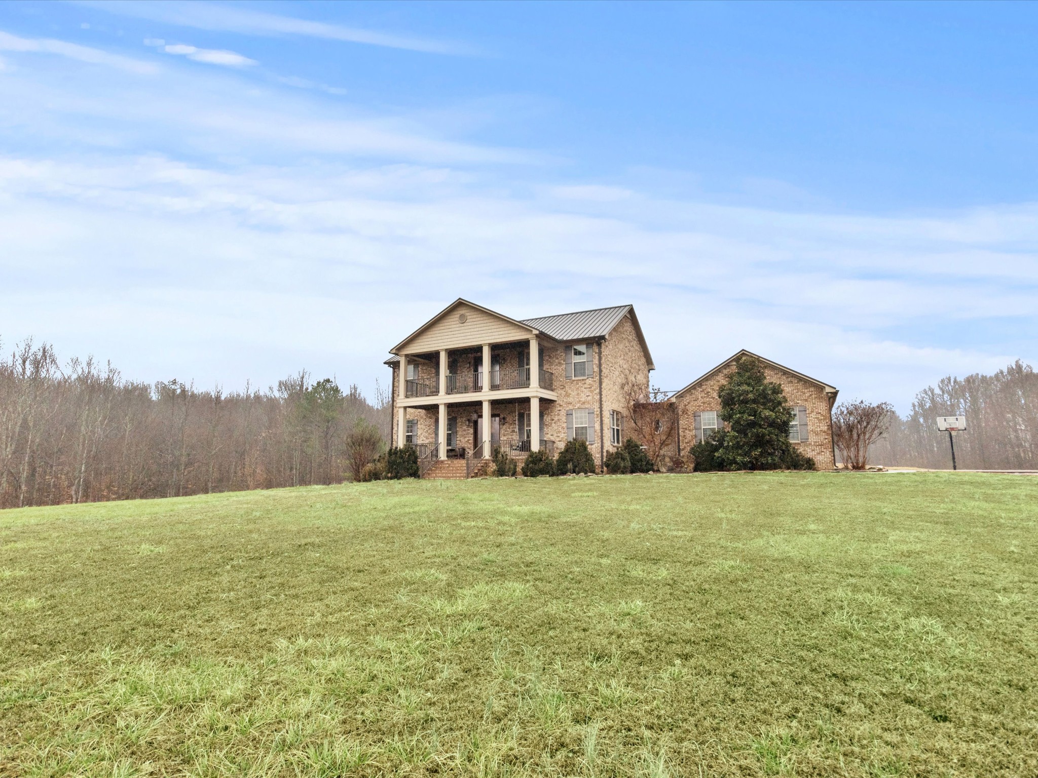 950 Puncheon Branch Road Minor Hill, TN 38473 - Photo 39 of 51 a big house with a big yard and large trees