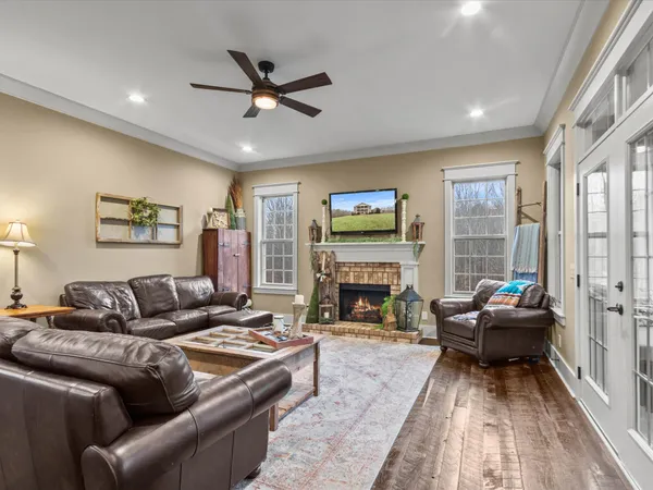 a living room with furniture and a fireplace