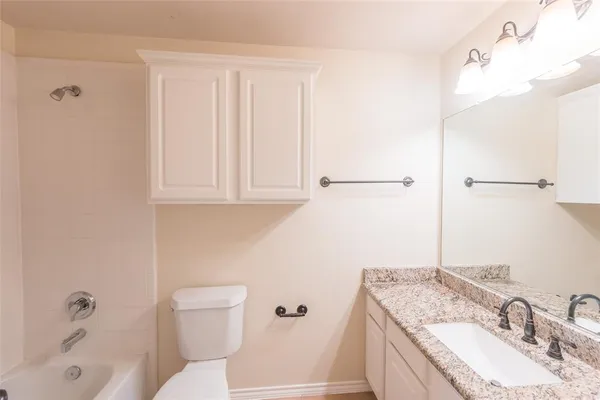 a view of a closet and chandelier fan in a room