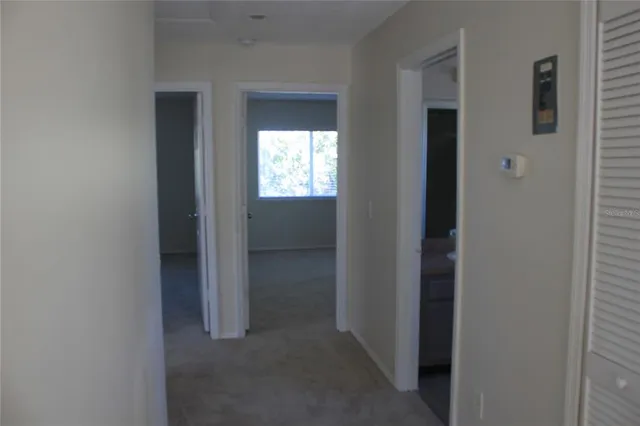 a view of hallway with closet