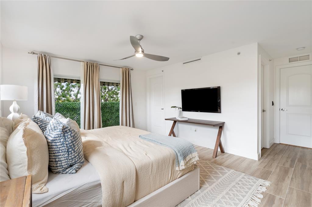 630 Southeast 15th Street, Unit 7 Fort Lauderdale, FL 33316 - Photo 8 of 21 a bedroom with a bed and a flat screen tv