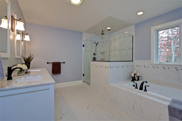 27 Douglas Road Lexington, MA 02420 - Photo 13 of 23 a bathroom with a sink and a bathtub