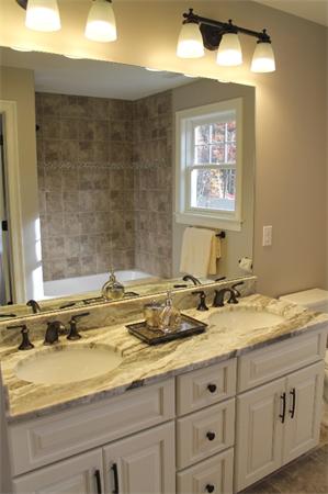 27 Douglas Road Lexington, MA 02420 - Photo 17 of 23 a bathroom with a granite countertop sink and a mirror