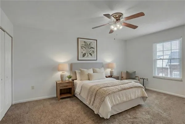 a bedroom with a bed and window