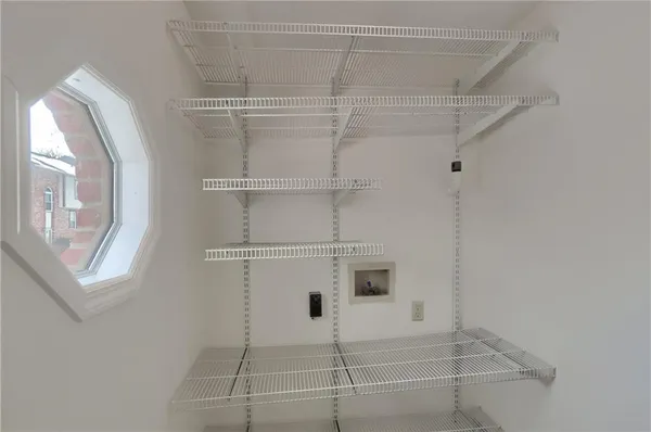 a room with closet and a window