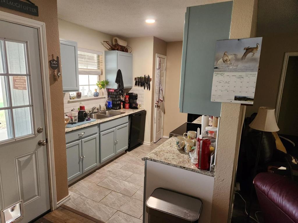 541 Bakers Branch Road Waxahachie, TX 75167 - Photo 6 of 13 a kitchen with a refrigerator and a stove top oven