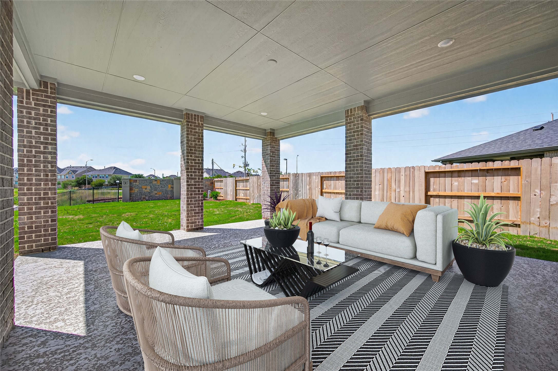 4702 Rustic Grv Lane Fulshear, TX 77441 - Photo 26 of 37 a living room with patio furniture and garden