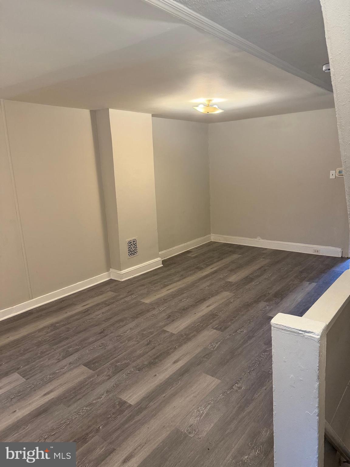 1223 Swede Street, Unit 2 Norristown, PA 19401 - Photo 7 of 10 a view of an empty room with wooden floor