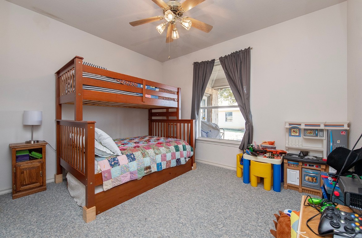 1833 County Road 305 Jarrell, TX 76537 - Photo 29 of 40 a bedroom with bed and a window