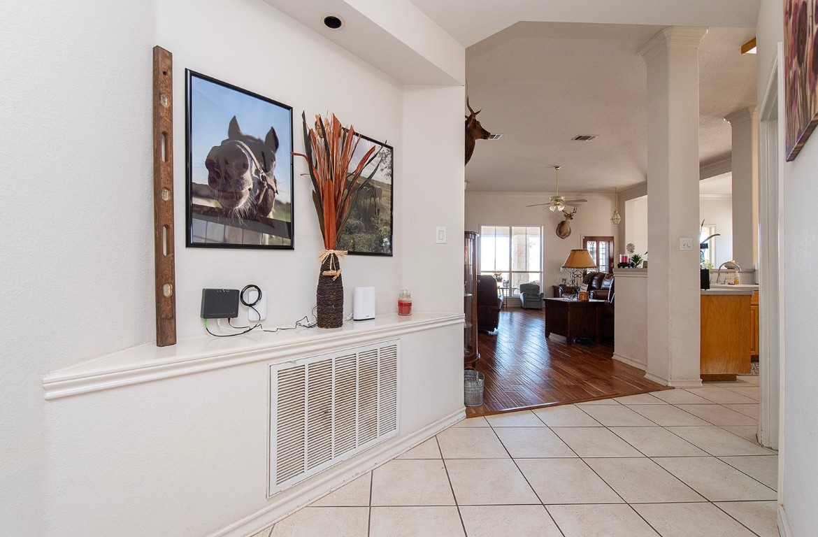 1833 County Road 305 Jarrell, TX 76537 - Photo 30 of 40 a hallway with a view of kitchen and living room