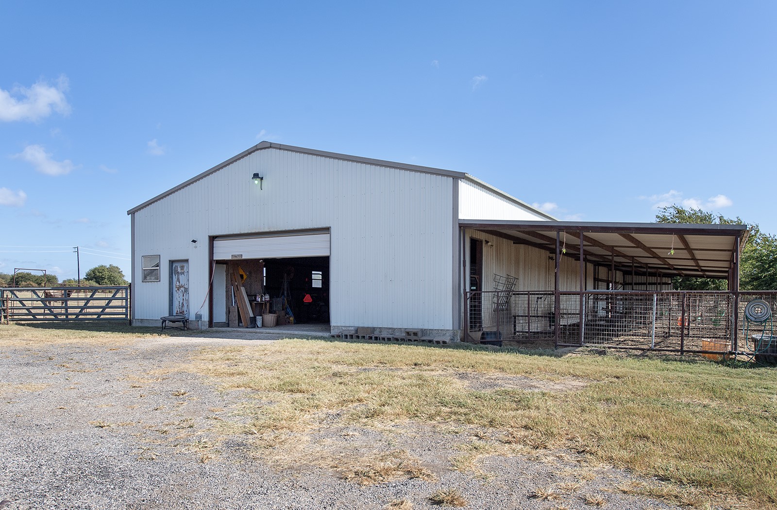 1833 County Road 305 Jarrell, TX 76537 - Photo 3 of 40 Hay Barn with tack room and covered stalls