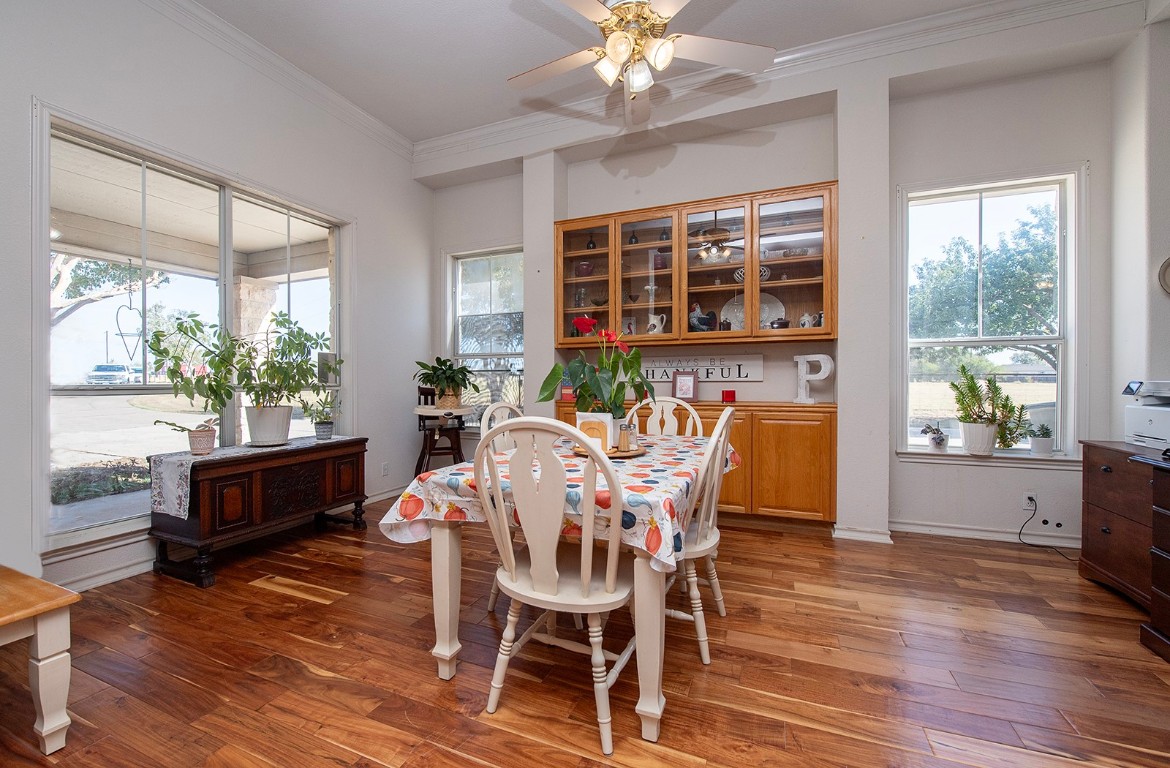 1833 County Road 305 Jarrell, TX 76537 - Photo 35 of 40 a view of a dining room with furniture window and wooden floor