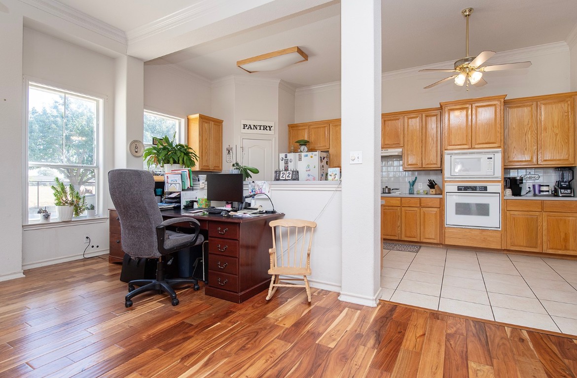 1833 County Road 305 Jarrell, TX 76537 - Photo 36 of 40 a view of a dining room with furniture window and wooden floor