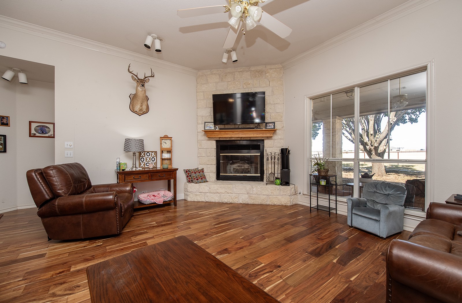 1833 County Road 305 Jarrell, TX 76537 - Photo 39 of 40 The den showing large windows and corner fireplace
