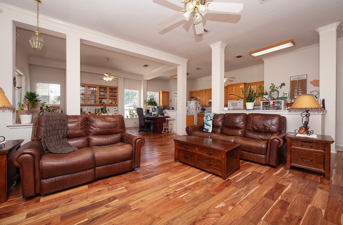 1833 County Road 305 Jarrell, TX 76537 - Photo 40 of 40 a living room with furniture and a chandelier