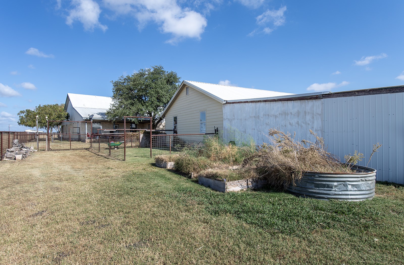 1833 County Road 305 Jarrell, TX 76537 - Photo 6 of 40 Above ground flower beds behind the chicken shed and next to the workshop all behind the house